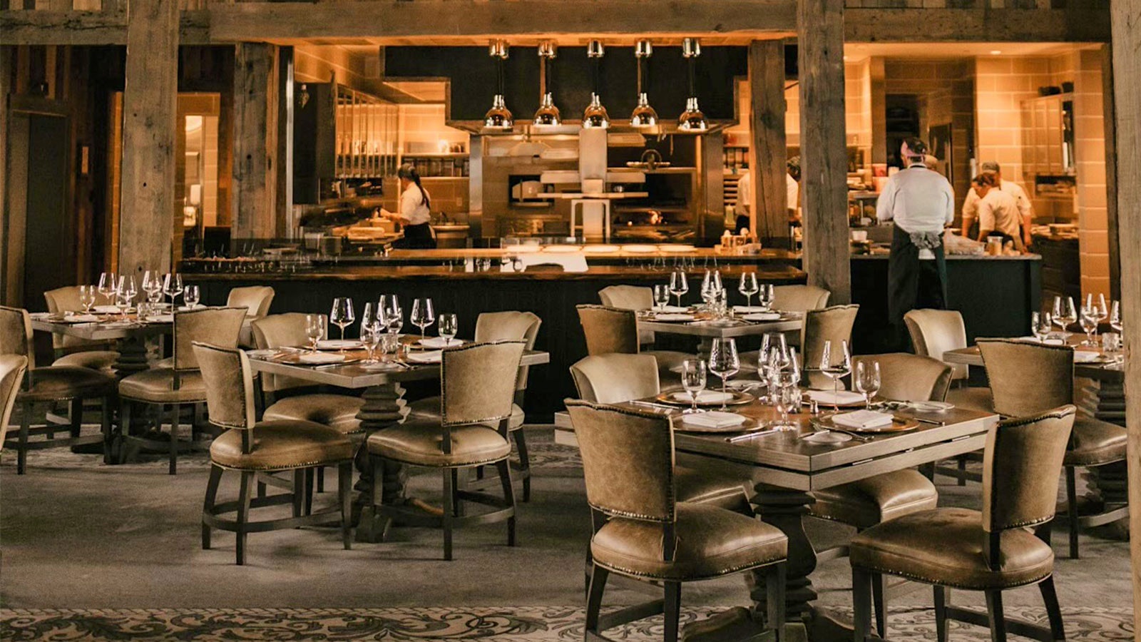 Set tables at the Cheyenne Club, looking into the open kitchen